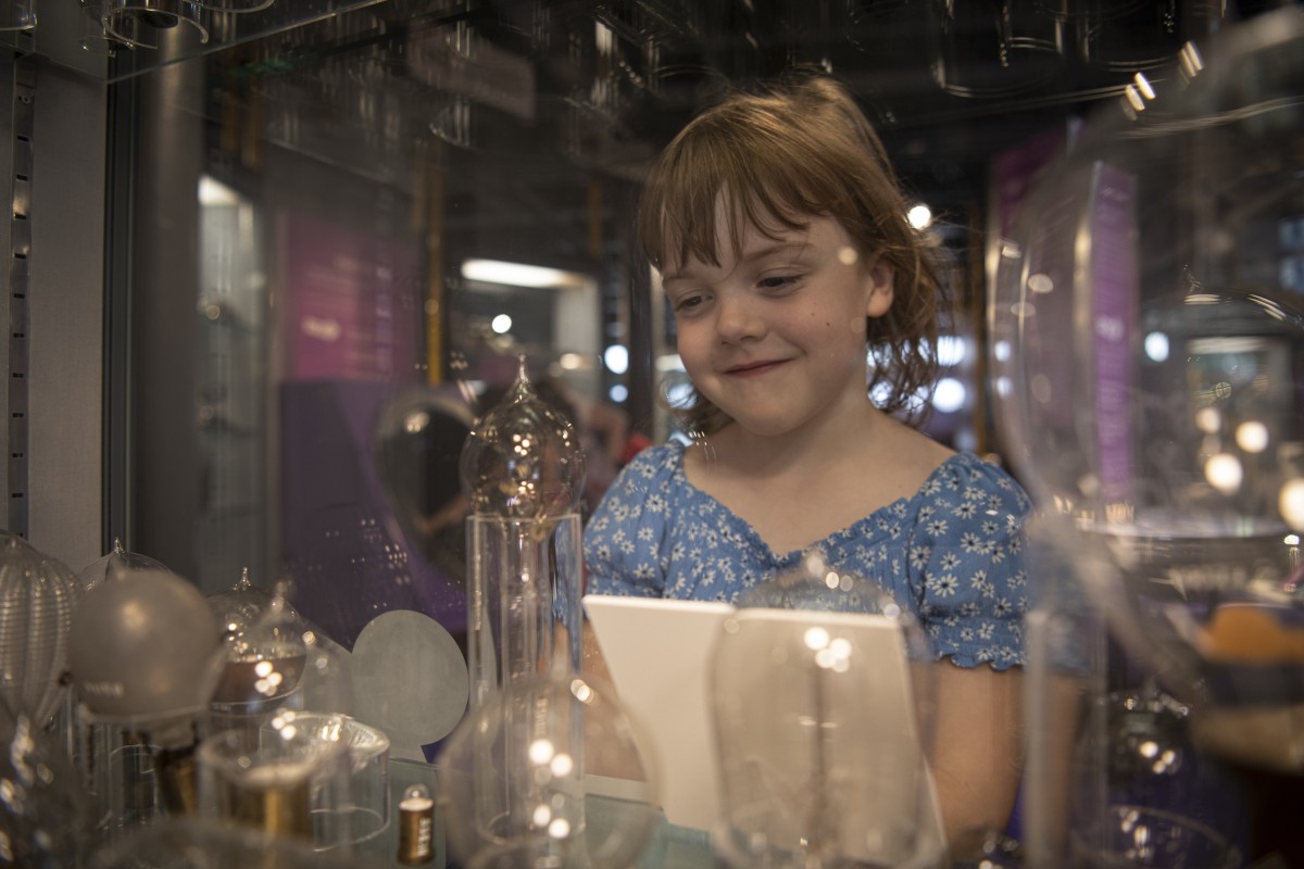 Alexa Page-Heaps age 6 - looks at light bulbs in Discovery Museum. Copyright Colin Davison/ Tyne & Wear Archives & Museums